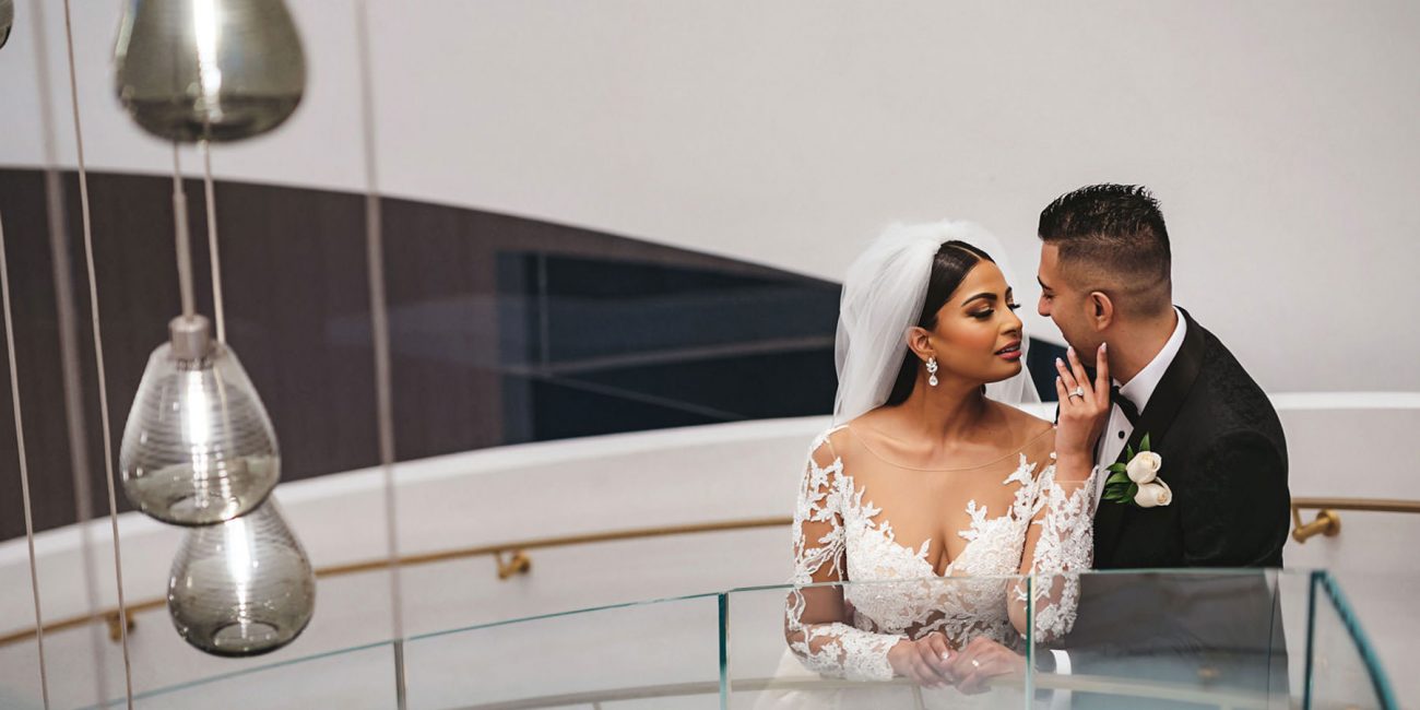 A bride and groom in a romantic pose at The Pearle Hotel