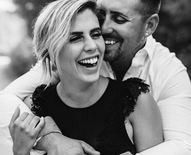A black and White photo of a couple on their engagement shoot